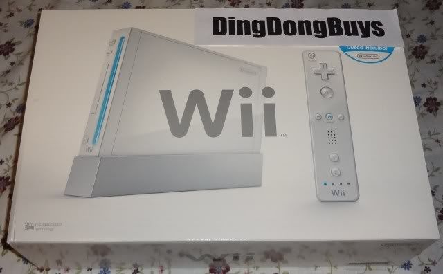 Picture of New, Open Box White Nintendo Wii Console / System with 1 set of controllers (1 Wii Remote and 1 Wii Nunchuck) and accessories only. No games.