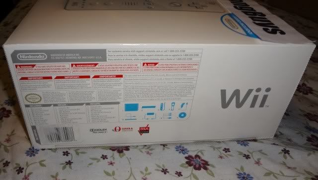 Picture of New, Open Box White Nintendo Wii Console / System with 1 set of controllers (1 Wii Remote and 1 Wii Nunchuck) and accessories only. No games.